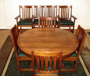 Vintage L. & J. G. Stickley 48 inch pedestal dining table & 4 original leaves.